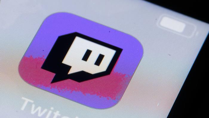 BERLIN, GERMANY - OCTOBER 11: In this photo illustration the logo of live streaming video platform Twitch is displayed on a smartphone on October 11, 2019 in Berlin, Germany. (Photo Illustration by Thomas Trutschel/Photothek via Getty Images)