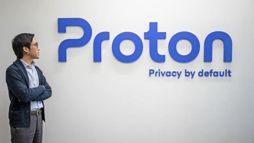 Proton CEO and founder Andy Yen poses next to the Proton logo at the headquarters of the encrypted email and VPN services company in Geneva on February 21, 2023. - Internet privacy company Proton can spot attacks on democracy in a country before it hits the headlines, simply by watching demand for its services explode, its chief told AFP. 