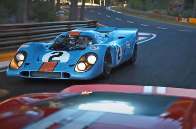 The Porsche 917 in Gulf livery seen racing in the video game 'Gran Turismo 7'.