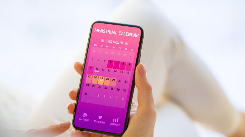 Woman using app for tracking her periods