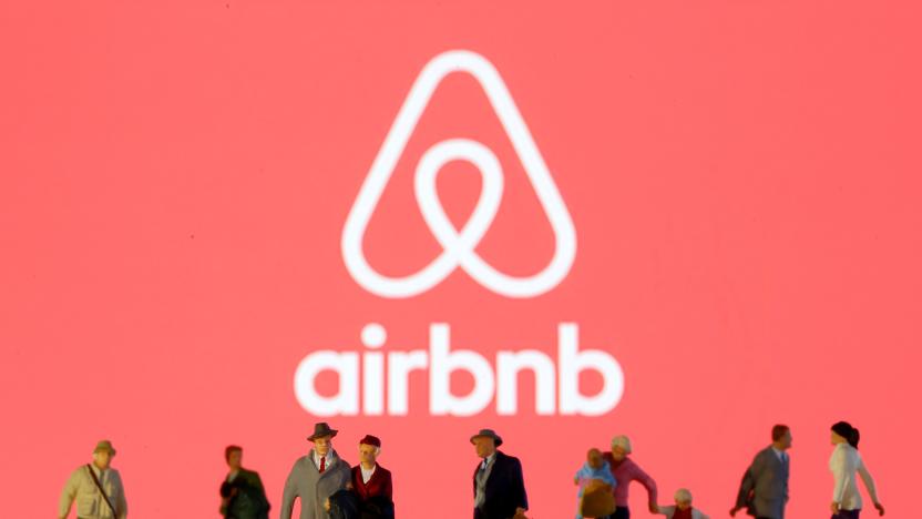 Small toy figures are seen in front of diplayed Airbnb logo in this illustration taken March 19, 2020. REUTERS/Dado Ruvic/Illustration