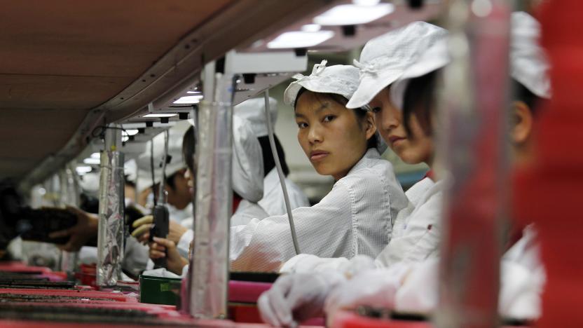 Workers are seen inside a Foxconn factory in the township of Longhua in the southern Guangdong province May 26, 2010. A spate of nine employee deaths at global contract electronics manufacturer Foxconn, Apple's main supplier of iPhones, has cast a spotlight on some of the harsher aspects of blue-collar life on the Chinese factory floor.   REUTERS/Bobby Yip  (CHINA - Tags: BUSINESS EMPLOYMENT)    FOR BEST QUALITY IMAGE ALSO SEE: GF2E9AP0D4F01