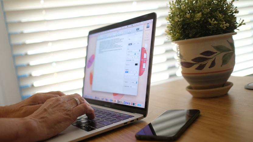 This illustration photo shows a person working on their laptop from a home office in Los Angeles on August 13, 2021. - In the United States, companies are delaying one after another the return of their employees to the office, worried about the new wave of contaminations with the spread of the Delta variant. (Photo by Chris DELMAS / AFP) (Photo by CHRIS DELMAS/AFP via Getty Images)