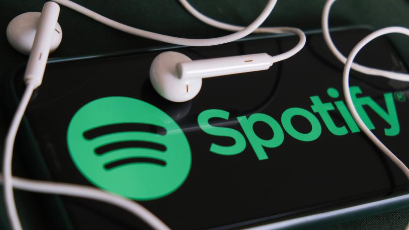 Spotify logo displayed on a phone screen and headphones are seen in this illustration photo taken in Krakow, Poland on February 3, 2022. (Photo Illustration by Jakub Porzycki/NurPhoto via Getty Images)