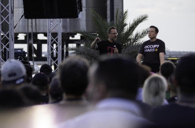 BOCA CHICA BEACH, TX - AUGUST 25: SpaceX founder Elon Musk and T-Mobile CEO Mike Sievert on stage during a T-Mobile and SpaceX joint event on August 25, 2022 in Boca Chica Beach, Texas. The two companies announced plans to work together to provide T-Mobile cellular service using Starlink satellites. (Photo by Michael Gonzalez/Getty Images)