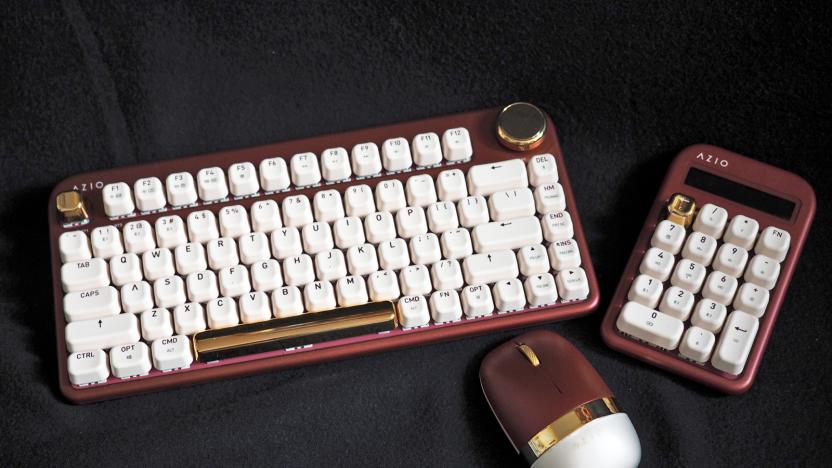 AZIO IZO keyboard and mouse peripherals photographed on a black cloth background.