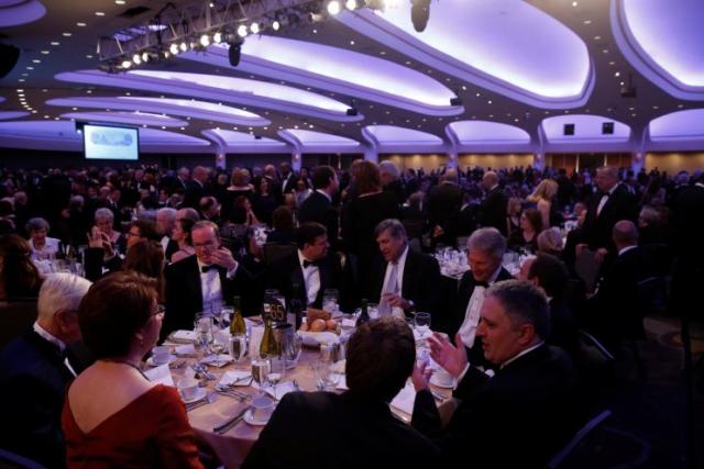 Attendees take their seats at the start of the White House Correspondents' Association dinner.