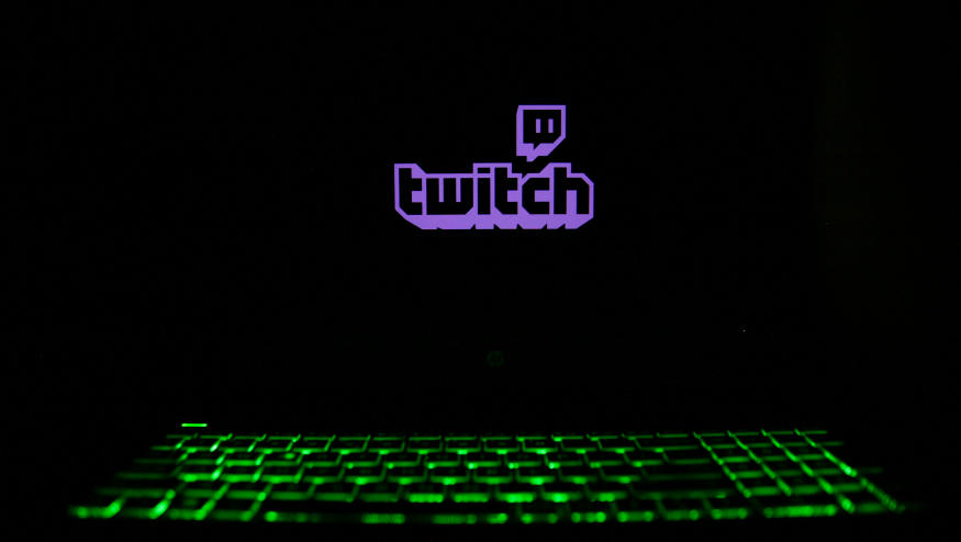 The Twitch logo is displayed on a laptop screen with a glowing keyboard in Krakow, Poland, on March 3, 2024. (Photo by Klaudia Radecka/NurPhoto via Getty Images)