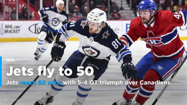 Jets reach 50 wins with 5-4 OT triumph over Canadiens