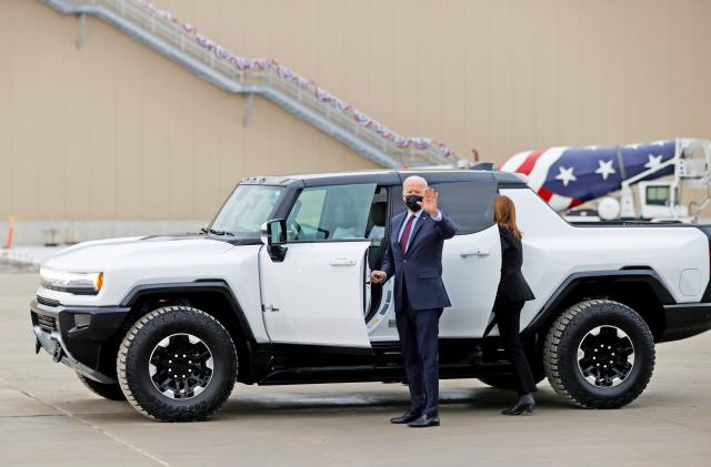 U.S. President Joe Biden waves as he tours the General Motors 'Factory ZERO' electric vehicle assembly plant in Detroit, Michigan, U.S. November 17, 2021. 