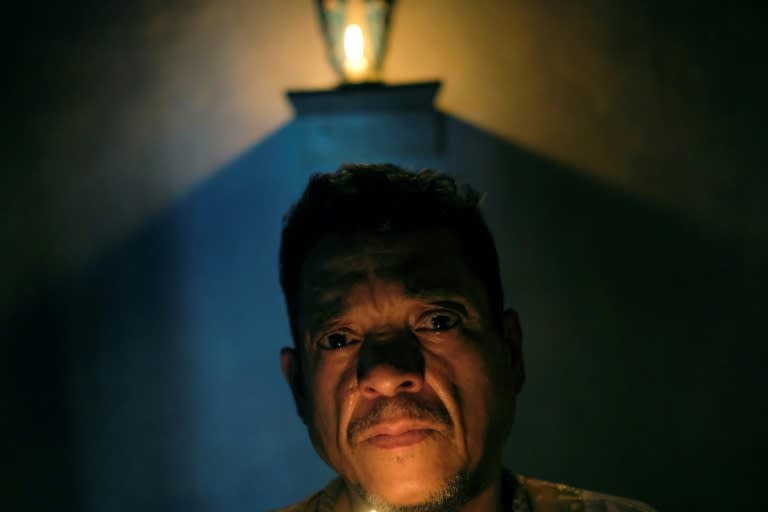 Venezuelan spiritual healer "Brother Guayanese" poses at his clinic in the Caracas neighborhood of Petare (AFP Photo/Matias Delacroix)