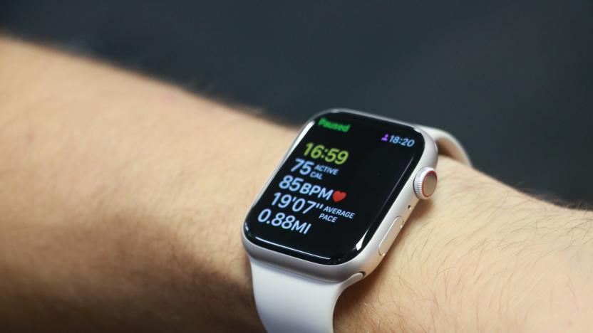 The Apple Watch Series 8 on a person's wrist, showing a paused workout tracking screen.