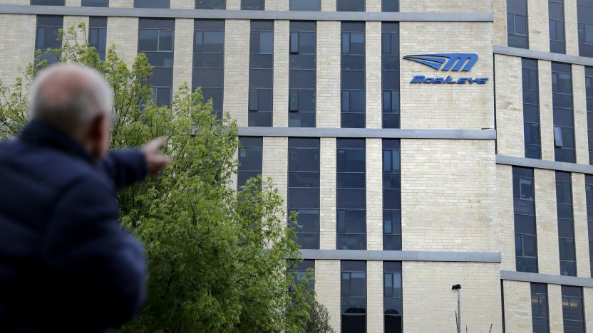 A man walks past the logo of Israeli car tech firm Mobileye on the company's offices in Jerusalem on March 13, 2017.
Intel will buy Mobileye for more than $15 billion (14 billion euros), the companies said, in a deal signalling the US computer chip giant's commitment to technology for self-driving vehicles. / AFP PHOTO / THOMAS COEX        (Photo credit should read THOMAS COEX/AFP via Getty Images)