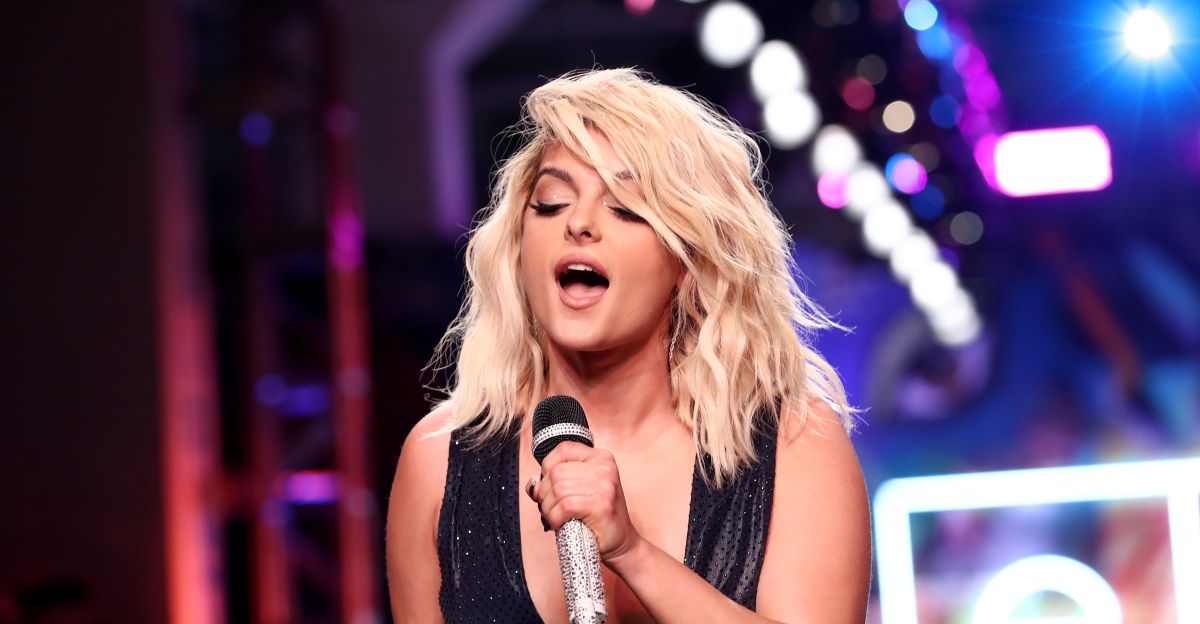 Fans are heavily supporting bebe rexha after a seriously uncomfortable  video showed her being hit in the face by a phone during her concert