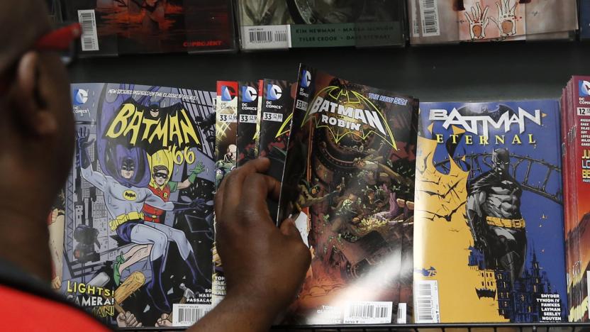A man reaches for a Batman comic book during Batman Day at the Midtown Comics store in New York July 23, 2014. Comic book stores are celebrating the 75th anniversary of the creation of the Caped Crusader.   REUTERS/Shannon Stapleton (UNITED STATES - Tags: SOCIETY ENTERTAINMENT)