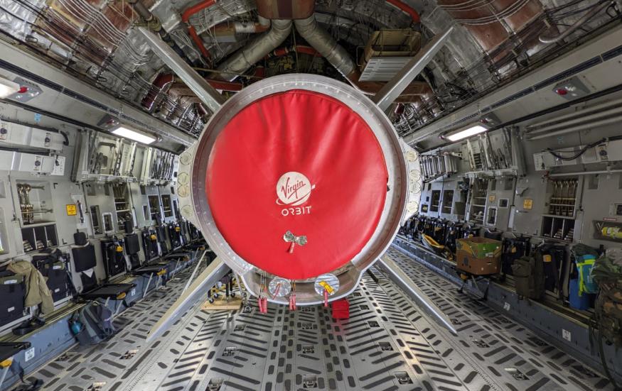 A photo showing Virgin Orbit's LauncherOne vehicle inside its carrier aircraft.