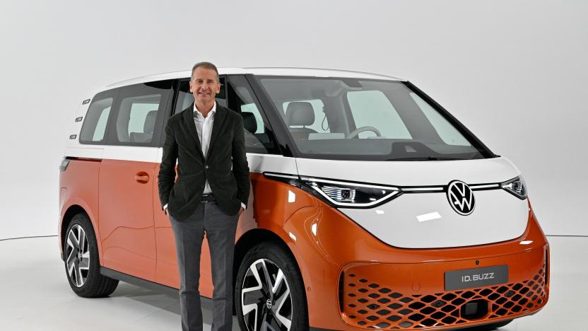 Volkswagen Group Chief Executive Officer (CEO) Herbert Diess poses with the new Volkswagen ID Buzz electric van during its presentation in Hamburg, northern Germany on March 9, 2022. - The German automaker unveiled the camper's latest iteration, known as the ID.Buzz, part of the flagship ID line with which Volkswagen is leading a multi-billion-euro charge into the electric car market. (Photo by John MACDOUGALL / AFP) (Photo by JOHN MACDOUGALL/AFP via Getty Images)