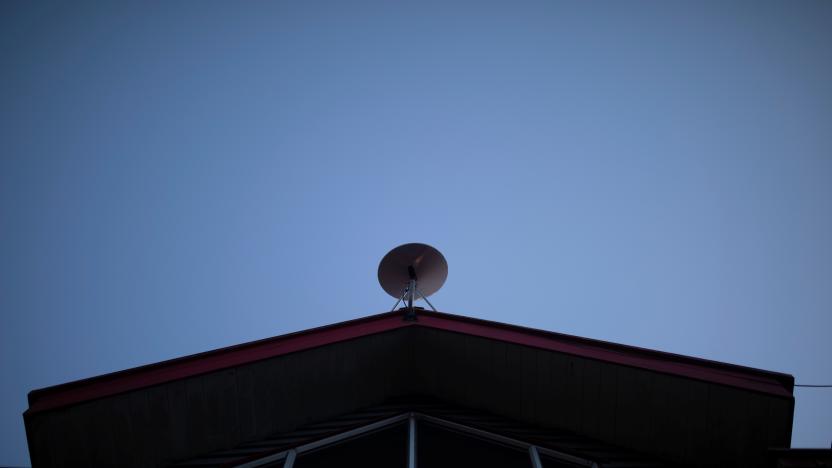 The Starlink antenna is seen on the roof of the John F Kennedy School located in the village of Sotomo, outside the town of Cochamo, Los Lagos region, Chile, August 7, 2021. Picture taken August 7, 2021. Sotomo is one of two places in Chile to be chosen for a pilot project run by billionaire Elon Musk to receive free internet for a year. The signal is received via a satellite dish installed on the school's roof, which transmits through a Wi-Fi device. REUTERS/Pablo Sanhueza         SEARCH "SOTOMO SANHUEZA" FOR THIS STORY. SEARCH "WIDER IMAGE" FOR ALL STORIES.