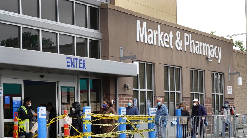 CHICAGO, ILLINOIS - MAY 19: Customers wait in line to enter a Walmart store on May 19, 2020 in Chicago, Illinois. Walmart reported a 74% increase in U.S. online sales for the quarter that ended April 30, and a 10% increase in same store sales for the same period as the effects of the coronavirus helped to boost sales. (Photo by Scott Olson/Getty Images)