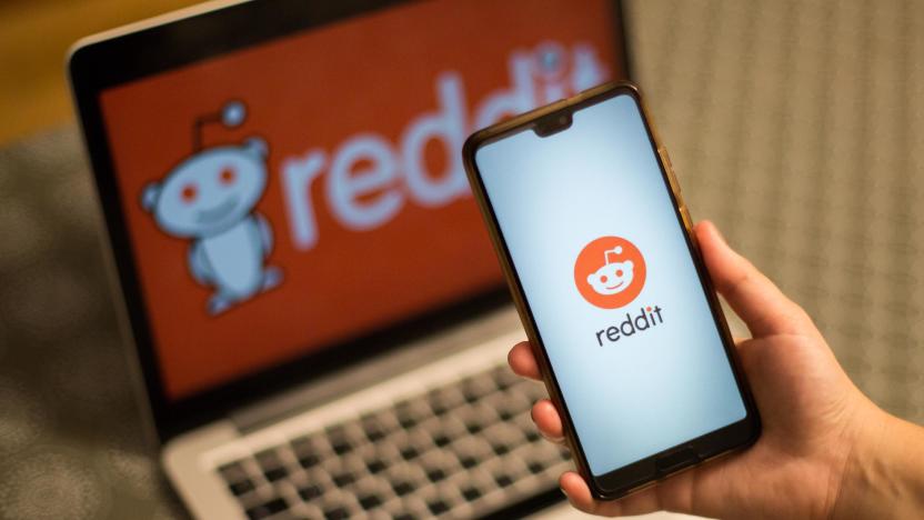 SPAIN - 2021/02/02: In this photo illustration a Reddit App and logo is seen displayed on a smartphone and a laptop screen in the background. (Photo Illustration by Thiago Prudêncio/SOPA Images/LightRocket via Getty Images)