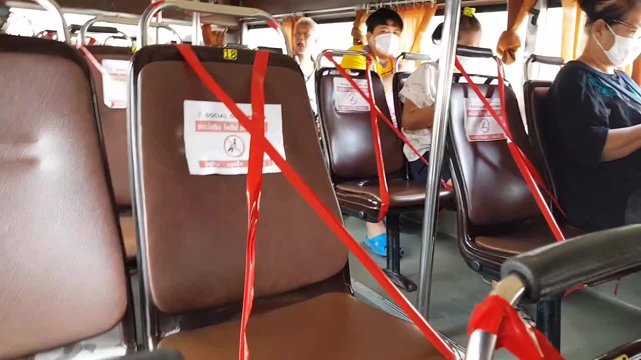 Thai bus seats blocked off with red tape to enforce COVID-19 ...