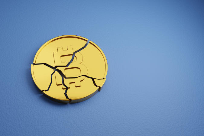 Broken Bitcoin with copy space. Cryptocurrency crash concept. 3d illustration.