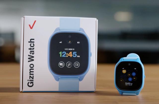 The Verizon Gizmo Watch 3 sitting on a table next to its packaging.