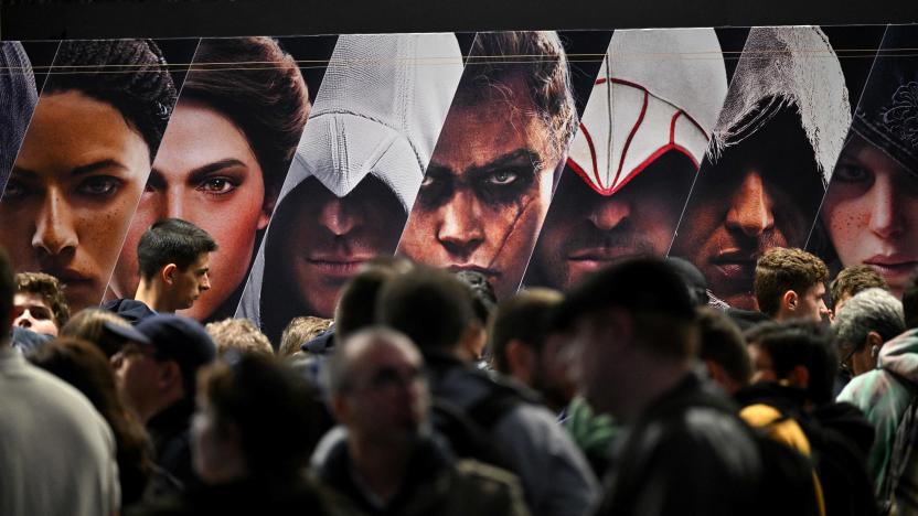 Visitors wait in line in front of Ubisoft's "Assasin's Creed"  video game booth on the opening day of the "Paris Games Week" video-game fair, after the cancellation of two editions due to the pandemic, with a banner of Nintendo's MarioKart Deluxe game in the background in Paris on November 2, 2022. - The largest French video game fair, Paris Games Week, is open on November 2 to 6. If video games remain the preferred digital leisure activity of young people, with 95% of 10-17 year olds playing them, the practice concerns more than 37 million French people, 53% even declaring that they play them "at least once a week", according to the Syndicat des editeurs de logiciels de loisirs (Leisure software editors union)(Sell). (Photo by Emmanuel DUNAND / AFP) (Photo by EMMANUEL DUNAND/AFP via Getty Images)