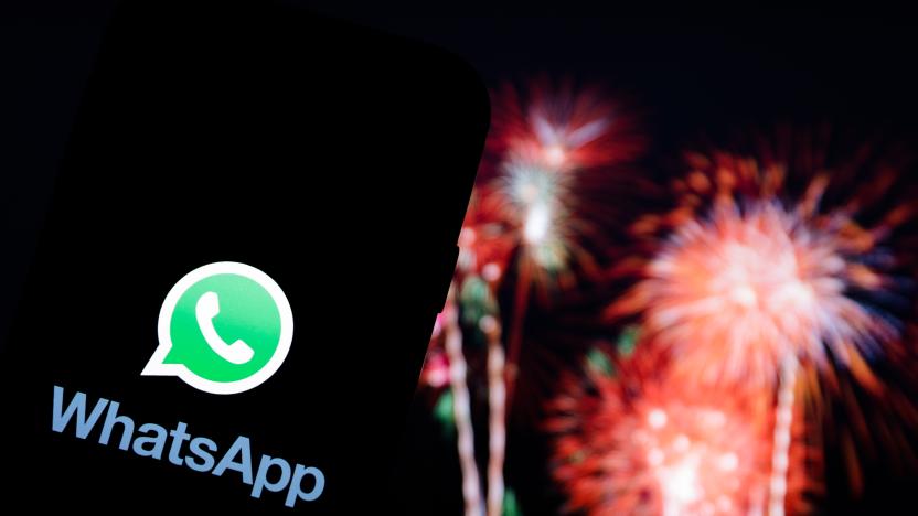 POLAND - 2020/12/30: In this photo illustration a Whatsapp logo seen displayed on a smartphone with fireworks in the background. (Photo Illustration by Filip Radwanski/SOPA Images/LightRocket via Getty Images)