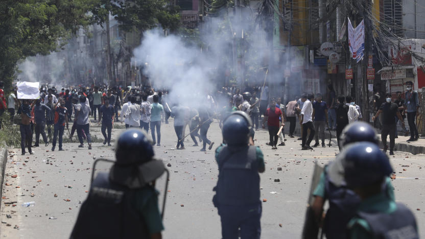 Students clash with riot police during a protest against a quota system for government jobs, in Dhaka, Bangladesh, Thursday, July 18, 2024. (AP Photo/Rajib Dhar)