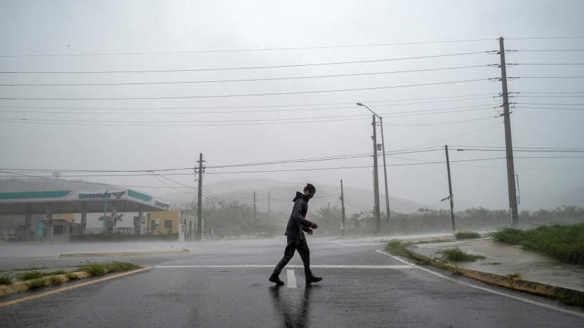 A man stands in the strong winds of Hurricane Fiona in Ponce, Puerto Rico September 18, 2022.  REUTERS/Ricardo Arduengo