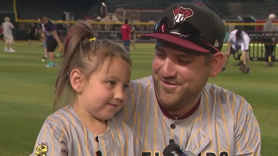 Play catch on the field before Diamondbacks game on Father's Day