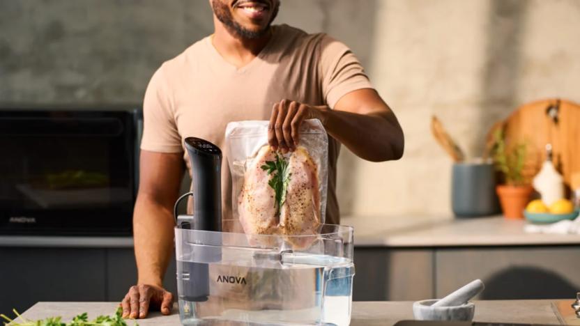 A guy cooking something with a sous vide machine.