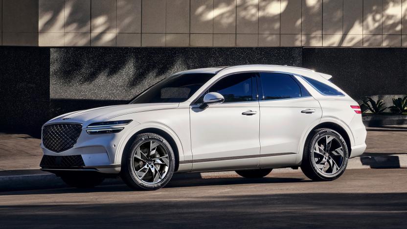 Hyundai's GV70 EV in white, parked on a city street.