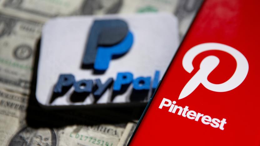 A Pinterest logo is seen on a smartphone placed over U.S. dollar banknotes and a 3D printed PayPal logo in this illustration taken October 20, 2021. REUTERS/Dado Ruvic/Illustration