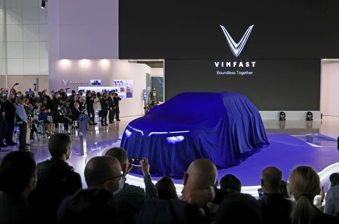 Attendees at the VinFast E35 SUV unveiling during the Vietnamese car company's EV global premiere during the 2021 LA Auto Show in Los Angeles, California, U.S. November, 17, 2021. 