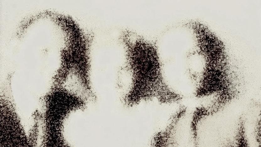 A faded family photo showing three people.