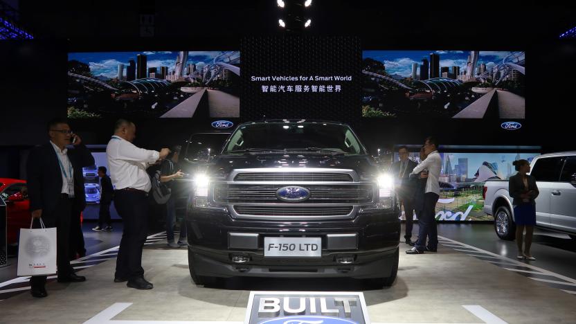 Visitors look at a Ford F-150 pickup displayed at the China International Import Fair (CIIE) in Shanghai, China November 6, 2019. Picture taken November 6, 2019.  REUTERS/Yilei Sun