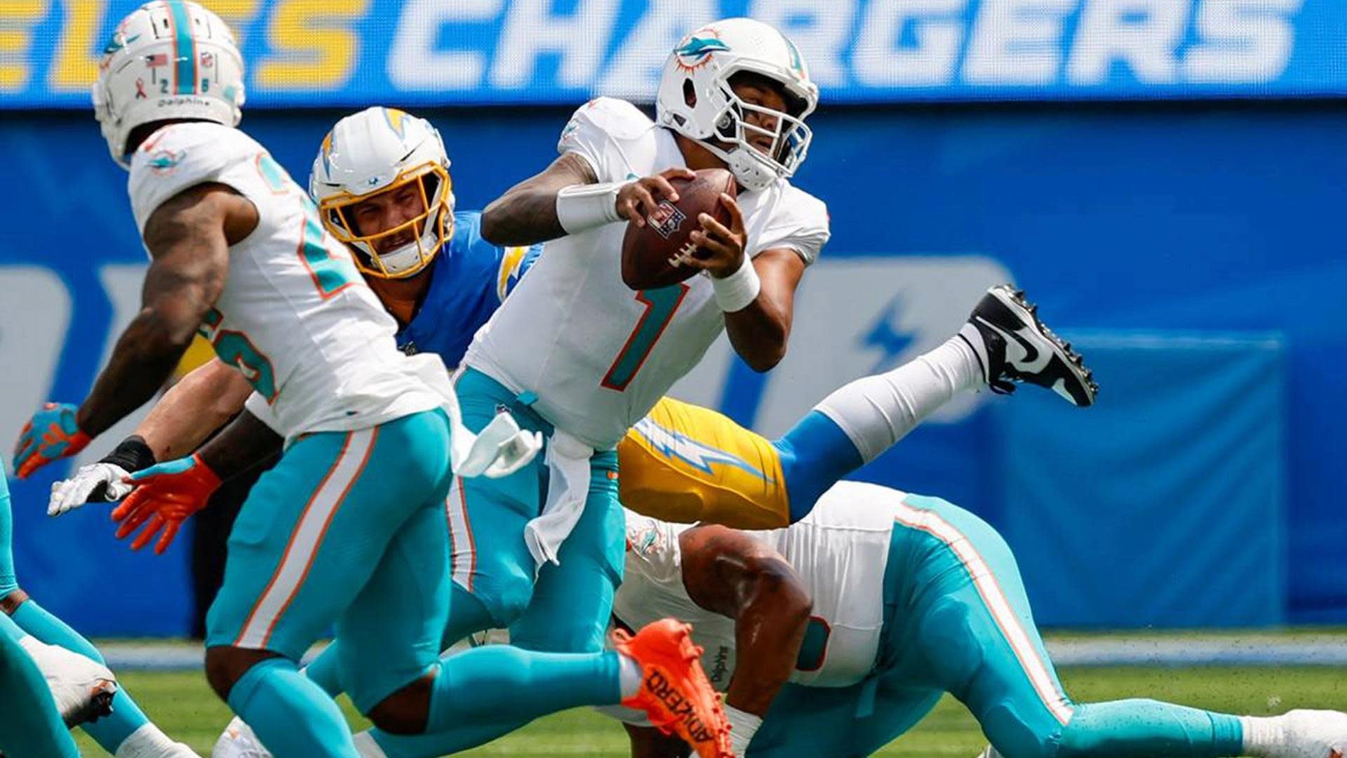 Miami Dolphins linebacker Jaelan Phillips (15) walks on the field ahead of  an NFL football game against the New York Jets, Sunday, Jan. 8, 2023, in  Miami Gardens, Fla. (AP Photo/Rebecca Blackwell