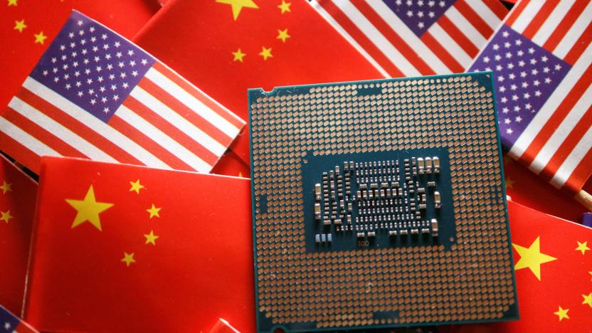 A central processing unit (CPU) semiconductor chip is displayed among flags of China and U.S., in this illustration picture taken February 17, 2023. REUTERS/Florence Lo/Illustration