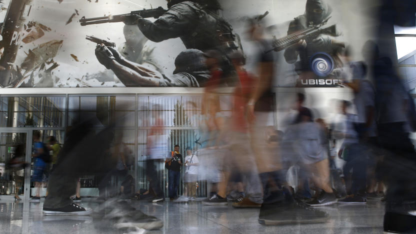 Visitors pass by a gaming booth of Ubisoft during the Gamescom fair in Cologne, Germany August 6, 2015. The Gamescom convention, Europe's largest video games trade fair, runs from August 5 to August 9. REUTERS/Kai Pfaffenbach TPX IMAGES OF THE DAY