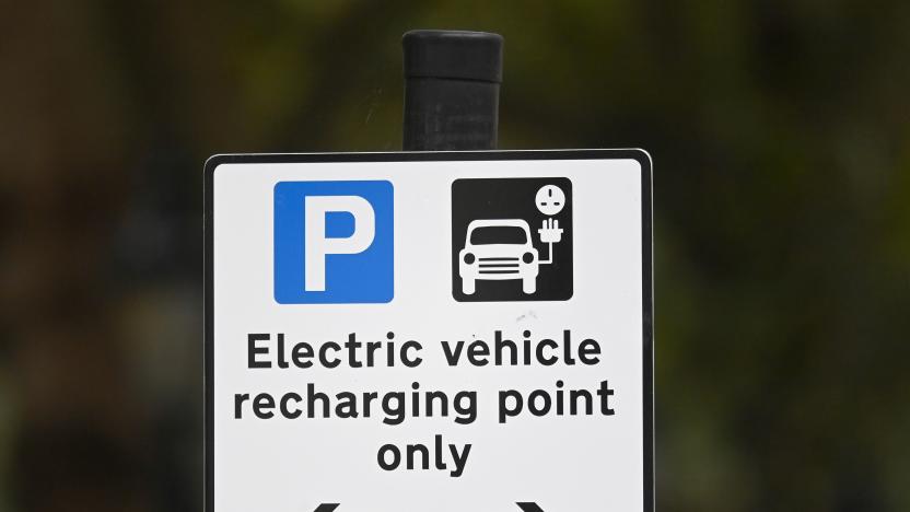 A roadside EV (electric vehicle) charge point sign is seen in London, October 19, 2021. REUTERS/Toby Melville