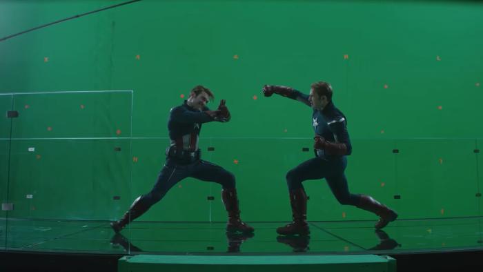 Behind-the-scenes shot of Avengers: Engdgame showing Chris Evans (Captain America) and a stud double posing against a green screen.
