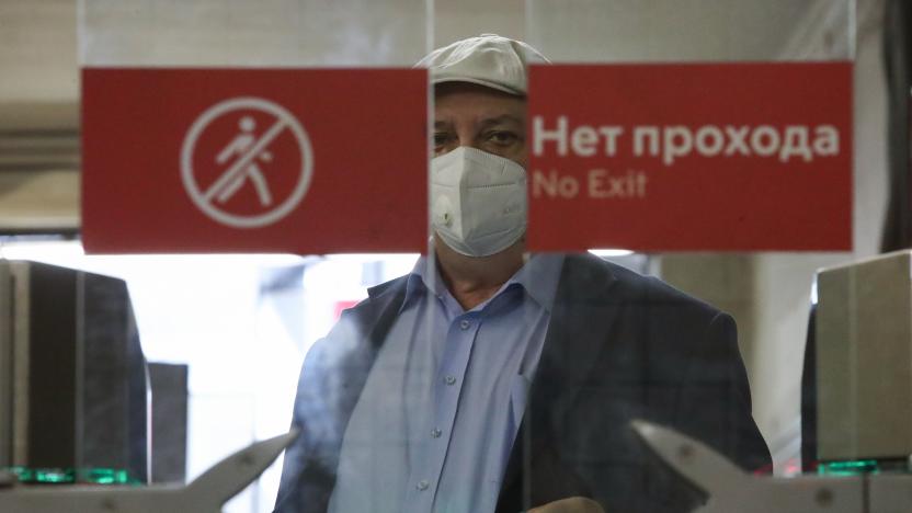 MOSCOW, RUSSIA - AUGUST 25, 2021: A man passes turnstiles to enter Smolenskaya station of the Filevskaya line featuring Face Pay, a facial recognition payment system to be introduced to the rest of the Moscow Metro stations by the end of 2021. Sergei Karpukhin/TASS (Photo by Sergei Karpukhin\TASS via Getty Images)