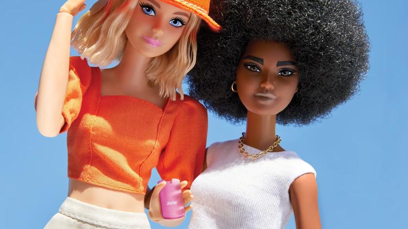 Two Barbies posed next to each other, with one holding a pink Barbie branded filp phone