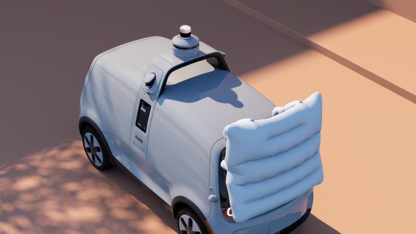 Aerial view of a robotic delivery truck with an airbag deployed on its front end.