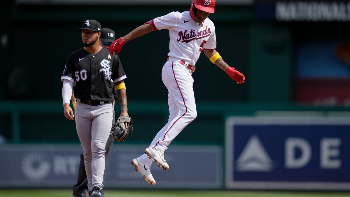 Washington Nationals shortstop CJ Abrams (5) scores on a fielding error by  Chicago White Sox shortstop Tim Anderson during the first inning of a  baseball game at Nationals Park, Wednesday, Sept. 20
