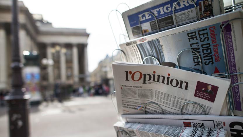 A copy of the newspaper "L'opinion" is pictured in a newsstand on May 15, 2013 in Paris. The newspaper, also available online, was released on May 15, 2013 in France. AFP PHOTO/FRED DUFOUR        (Photo credit should read FRED DUFOUR/AFP via Getty Images)