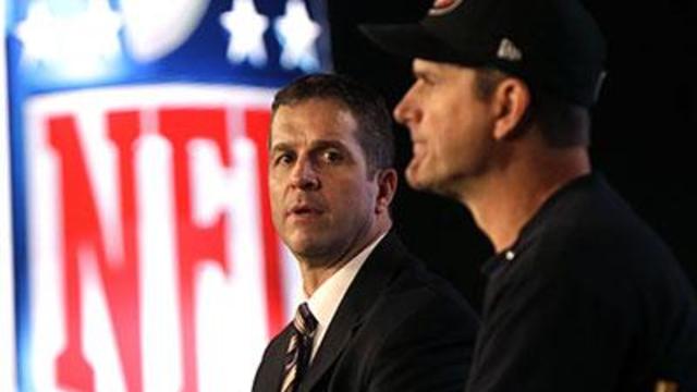 Harbaugh Brothers Share Same Stage, Same Focus