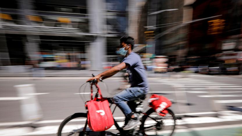 A rider for "Grubhub" food delivery service rides a bicycle during a delivery in midtown Manhattan following the outbreak of the coronavirus disease (COVID-19) in New York City, New York, U.S., July 9, 2020. REUTERS/Mike Segar